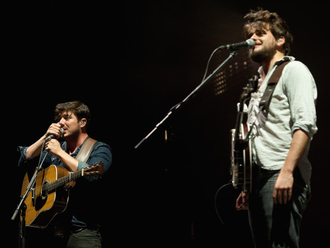 KANSAS CITY, KS - SEPTEMBER 20:  Lead singer Marcus Mumford and banjo player Winston Marshall performing with Mumford & Sons at the Cricket Wireless Amphitheater on September 20, 2013 in Kansas City, Kansas.  (Photo by Fernando Leon/Getty Images)