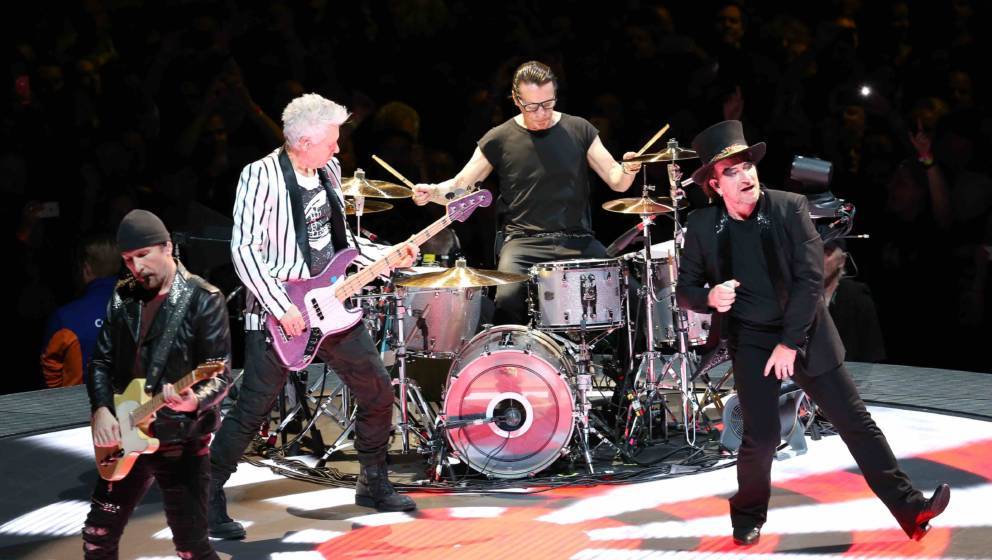 LONDON, ENGLAND - OCTOBER 23: The Edge, Adam Clayton, Larry Mullen's Jr and U2's Bono perform on stage during the 'Inno'