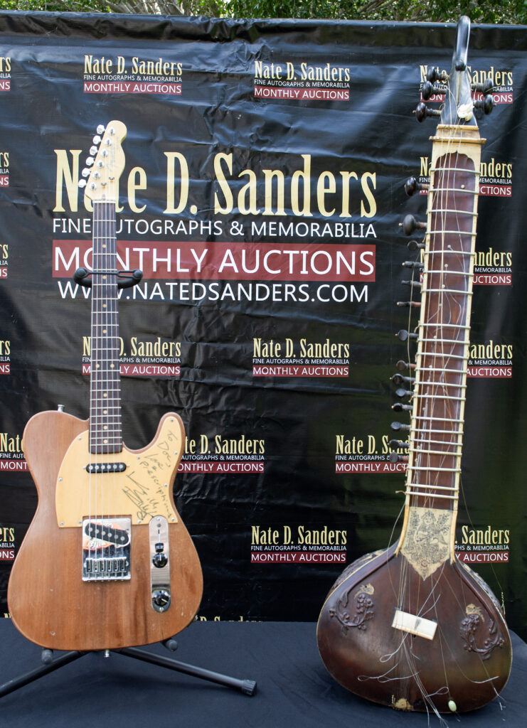 (L-R) British musician Keith Richards' custom-made Fender Telecaster guitar and British musician George Harrison's 1965 sitar are displayed during a press preview at Nate D. Sanders Auctions in Los Angeles on April 23, 2024. The instruments are set to be auctioned on April 25. (Photo by VALERIE MACON / AFP) (Photo by VALERIE MACON/AFP via Getty Images)