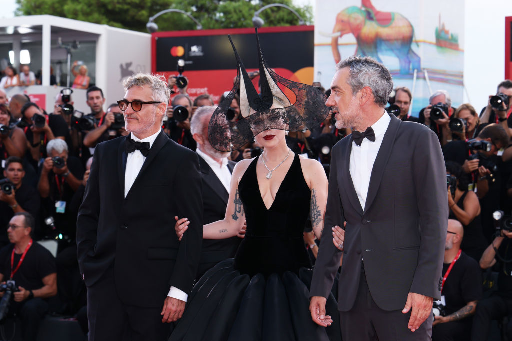 VENICE, ITALY - SEPTEMBER 04: Joaquin Phoenix, Lady Gaga and Director Todd Phillips attend the "Joker: Folie à Deux" red carpet during the 81st Venice International Film Festival at Sala Grande on September 04, 2024 in Venice, Italy. (Photo by Ernesto Ruscio/Getty Images)